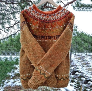 Detail of retro Fair Isle knit sweater showing earthy tones and intricate texture