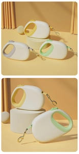 Detail of retractable dog leash with 360-degree golden swivel hook and ergonomic grip