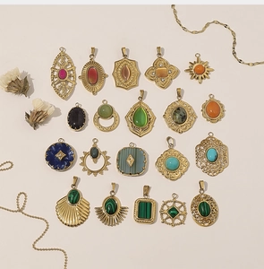 Detail of vintage 18k gold-plated pendants featuring assorted colorful natural gemstones