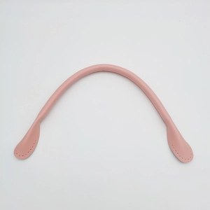 Close-up of pink leather handbag replacement handle with detailed stitching holes