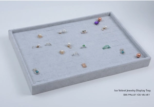 Macro view of grey ice velvet tray with 100 slots showing rings and earrings display
