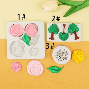 Detailed view of flexible silicone molds for rose, tree and flower fondant cake borders