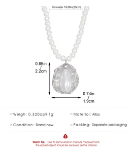 Macro view of bohemian pearl necklace with silver-rimmed drop shell pendant and dimensions