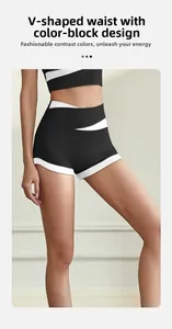 Detail of high waist V-shaped waistband and colorblock design on black sports yoga shorts