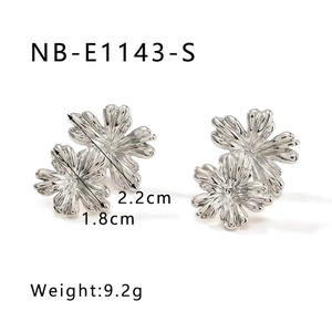 Detailed macro view of silver flower stud earrings with 2.2cm x 1.8cm size dimensions