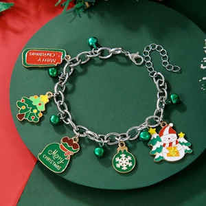 Detail of Christmas charm bracelet with silver bells, tree and snowman charms