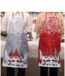 Detail of red and grey Christmas gnomes aprons with snowflakes and double pockets
