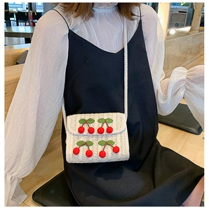 Straw square crossbody bag for women with decorative 3D red cherries and woven strap