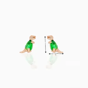 Close-up of 18K gold dinosaur studs with green zircons showing dimensions 9mm by 7mm