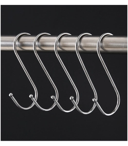Set of five silver S-shaped metal hooks hanging on a steel rod with polished finish