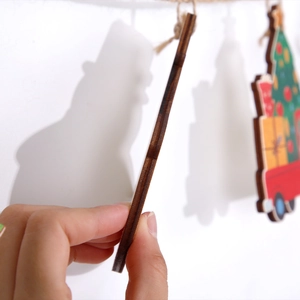 Detailed close-up showing the 3mm thickness of the wooden Christmas hanging ornament