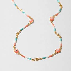 Detailed view of bohemian beaded necklace with evil eye pendant and colorful gravel beads
