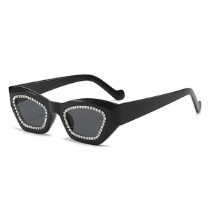 Retro cat-eye sunglasses with black rhinestone-encrusted frames in a 45-degree angle view
