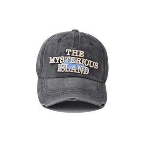 Detail of embroidered The Mysterious Island logo on washed cotton baseball cap