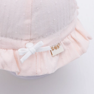 Pink infant sun hat with floral bow and ruffle brim for baby girls outdoor outings