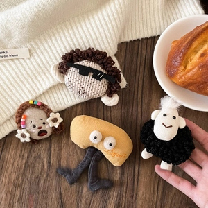 Plush fabric cartoon brooches including portrait and sheep shapes on winter clothes