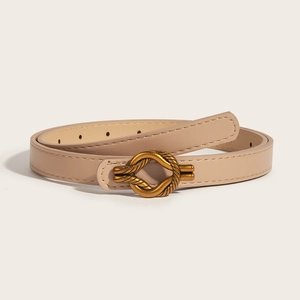 Minimalist beige PU leather skinny belt with golden twist buckle on plain background