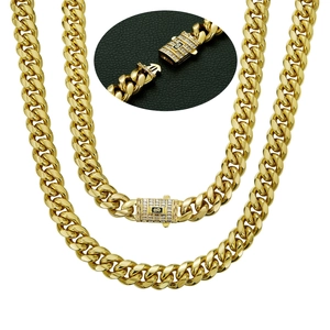 Detailed close-up of 14K gold plated Cuban chain necklace with micro-pave zircon S clasp