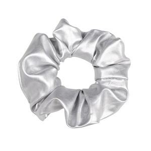 Chic silver Y2K PU leather scrunchie with metallic finish and soft folds on white backdrop