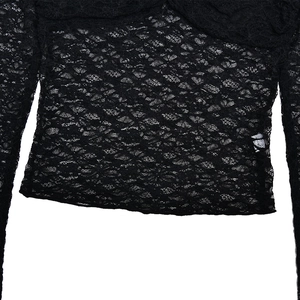 Close-up of black sheer lace crop top featuring intricate floral mesh patterns and wavy hem