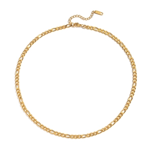 Detailed close-up of gold Figaro chain link with adjustable lobster clasp and S.Steel tag