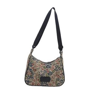 Floral crossbody bag with embroidery patterns and adjustable black shoulder strap