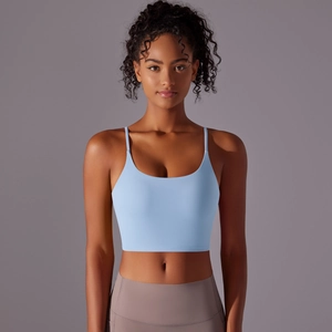Close-up of light blue high-impact sports bra with thin straps and U-neckline detail