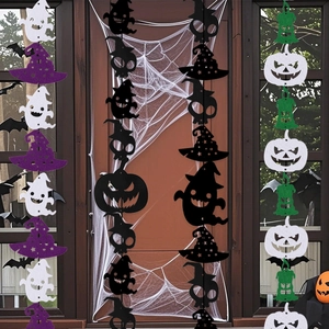 Felt Halloween garlands featuring ghosts and pumpkins hanging on a spooky doorway