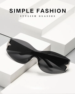 Detail of Y2K rimless sunglasses featuring silver star decor on dark grey lenses