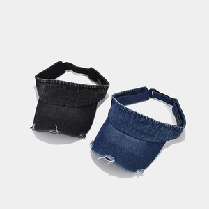 Vintage distressed denim sun visors in black and blue with stylish frayed brim details