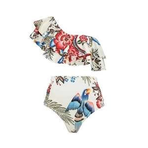 Detail view of one-shoulder bikini with tropical parrot print and ruffled trim design