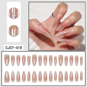 Medium-long almond press-on nails featuring nude pink gradient and silver glitter foil