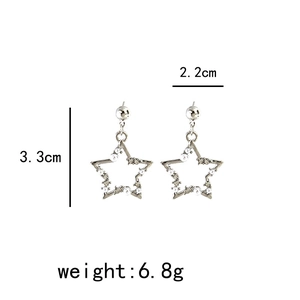 Detail view of silver star earrings with pearls and diamonds including size dimensions