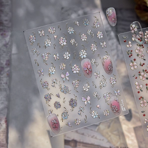 Macro view of TO-5327 nail stickers featuring metallic butterfly and peony motifs
