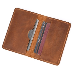 Detail of vintage brown crazy horse leather wallet showing interior slots and stitching