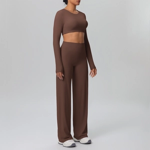 Detail view of brown long sleeve crop top and high waist wide leg yoga pants set