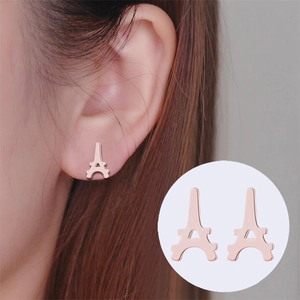 Rose gold Eiffel Tower shaped stud earrings shown on model and in detail for women