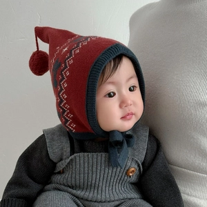 Winter baby knit hat with pom-pom and snowflake pattern for warm ear protection