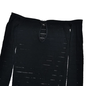 Detail of black off-shoulder knit bodysuit with teardrop cutout and silver ring