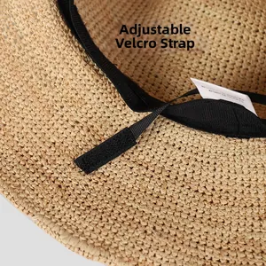 Detail of adjustable velcro strap inside raffia sun hat for custom head size fitting