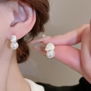 Minimalist irregular silver stud earrings with white pearl detail for women's fashion