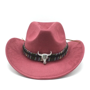 Macro detail of wine red suede cowboy hat with ethnic woven band and bull head ornament