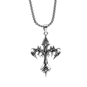 Detailed close-up of gothic silver cross pendant with intricate flame patterns and box chain