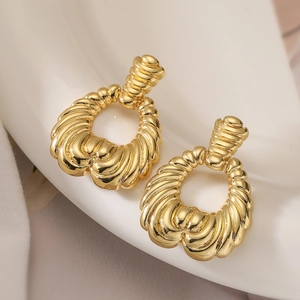 Elegant gold-tone irregular waterdrop hoop earrings with textured shell pattern surface