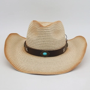 Detail of bohemian straw cowboy hat featuring turquoise stone and silver studs on band