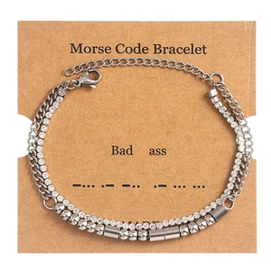 Detail of double-layer Morse code bracelet with crystals and silver-tone beads on card