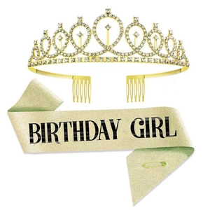 Detail of a sparkling gold rhinestone tiara and golden glitter Birthday Girl sash set