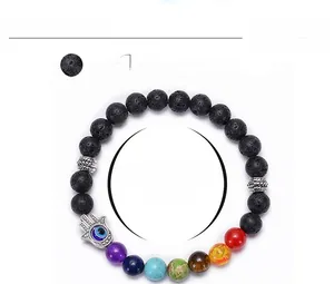Detail view of 8mm lava stone bracelet showing Hamsa Hand charm and dimensions