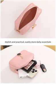 Detailed view of pink woven bag with cat zipper charm and spacious interior for essentials