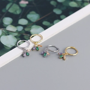 Detail of s925 silver earrings with colorful rectangular zircon drop pendants in gold and silver